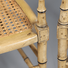 Load image into Gallery viewer, A Pair of Cream Painted Simulated Bamboo Elbow Chairs
